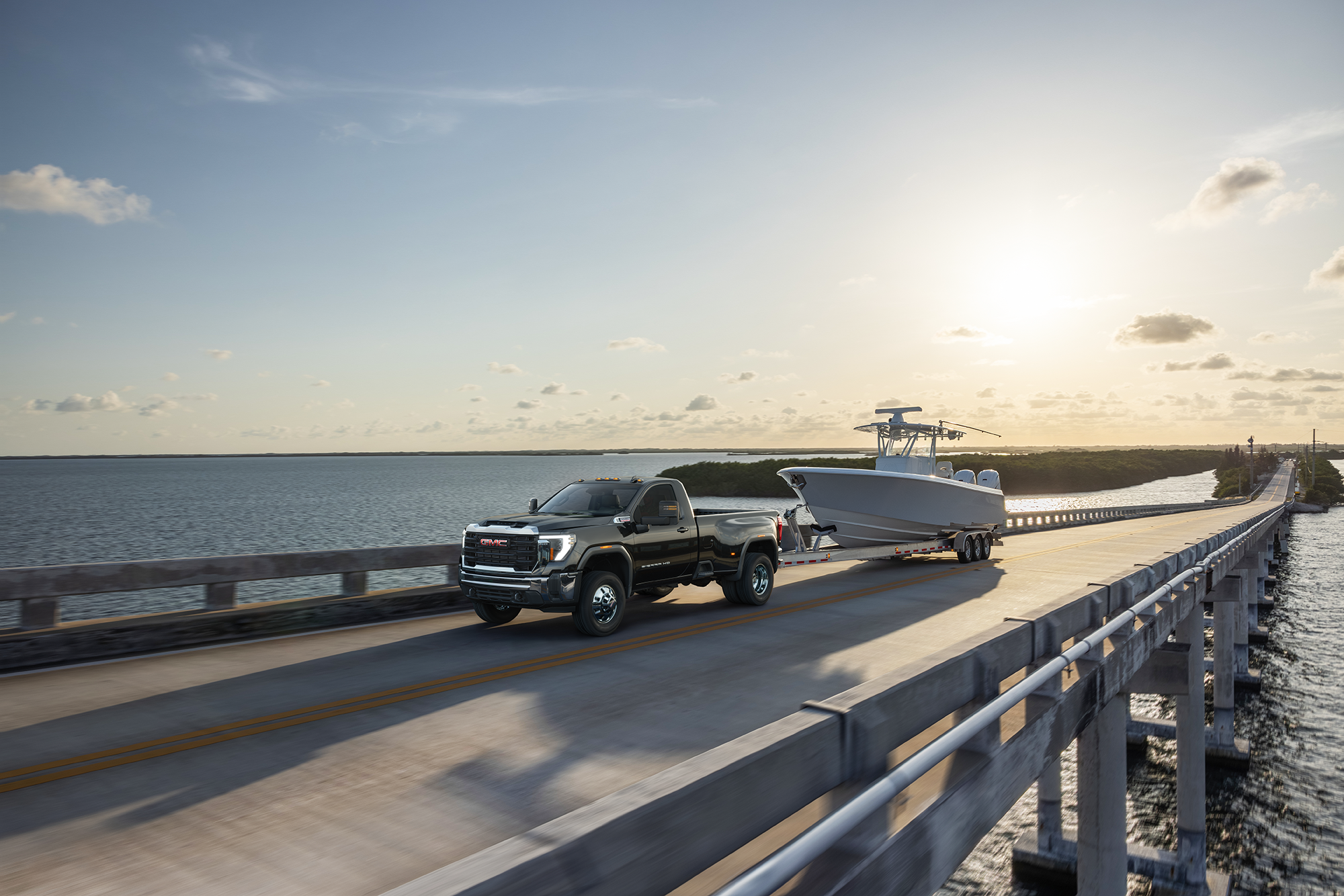 Used GMC truck towing a boat