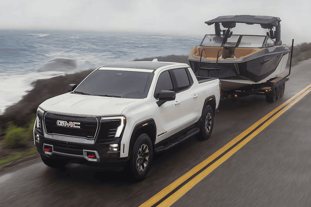 2026 GMC Sierra EV towing a boat