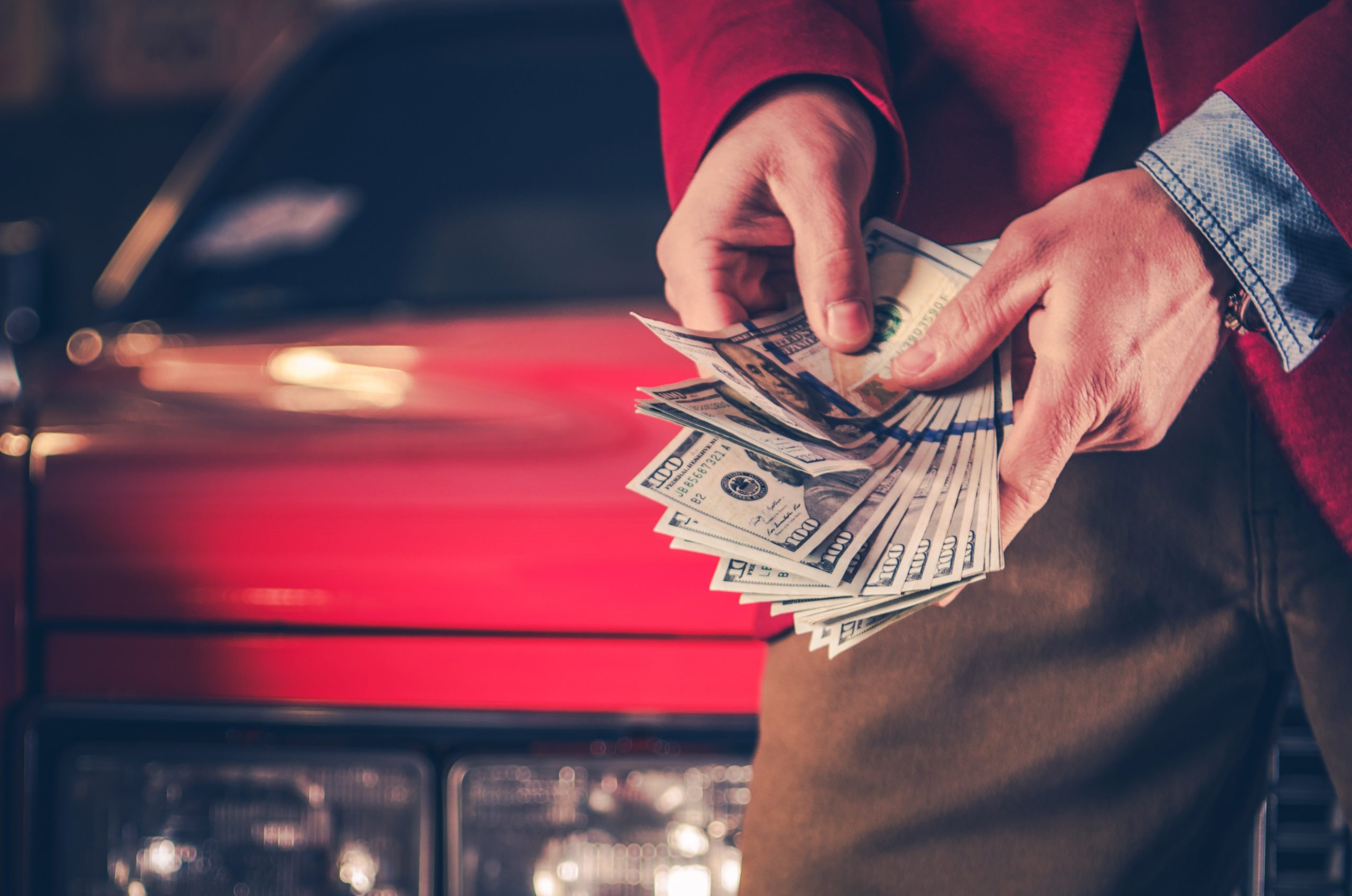Customer holding cash in his hands